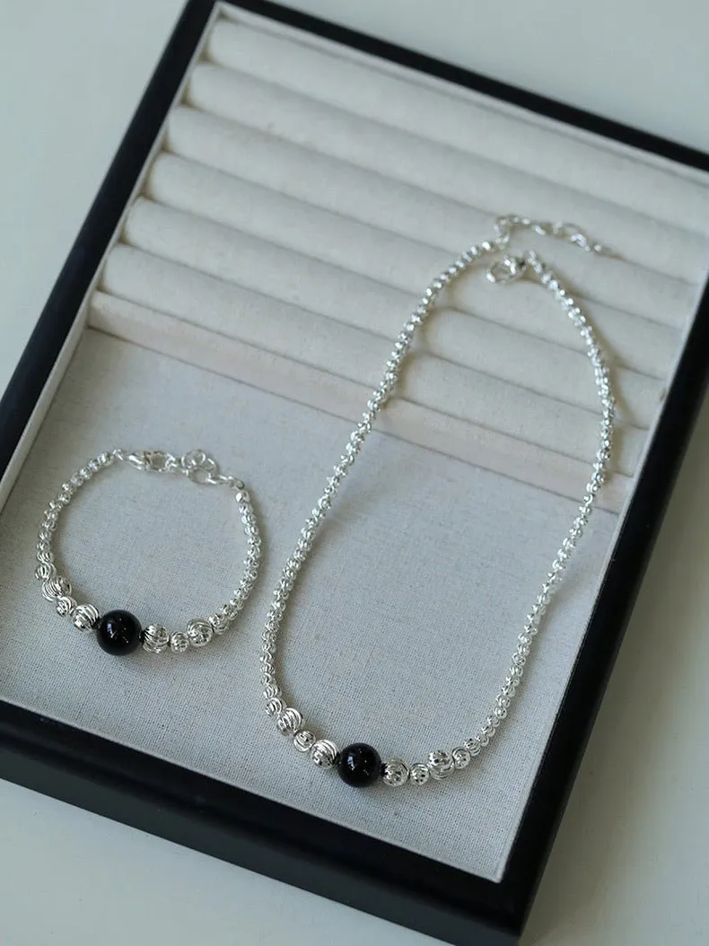 Graduated Silver Bean and Onyx Bracelet