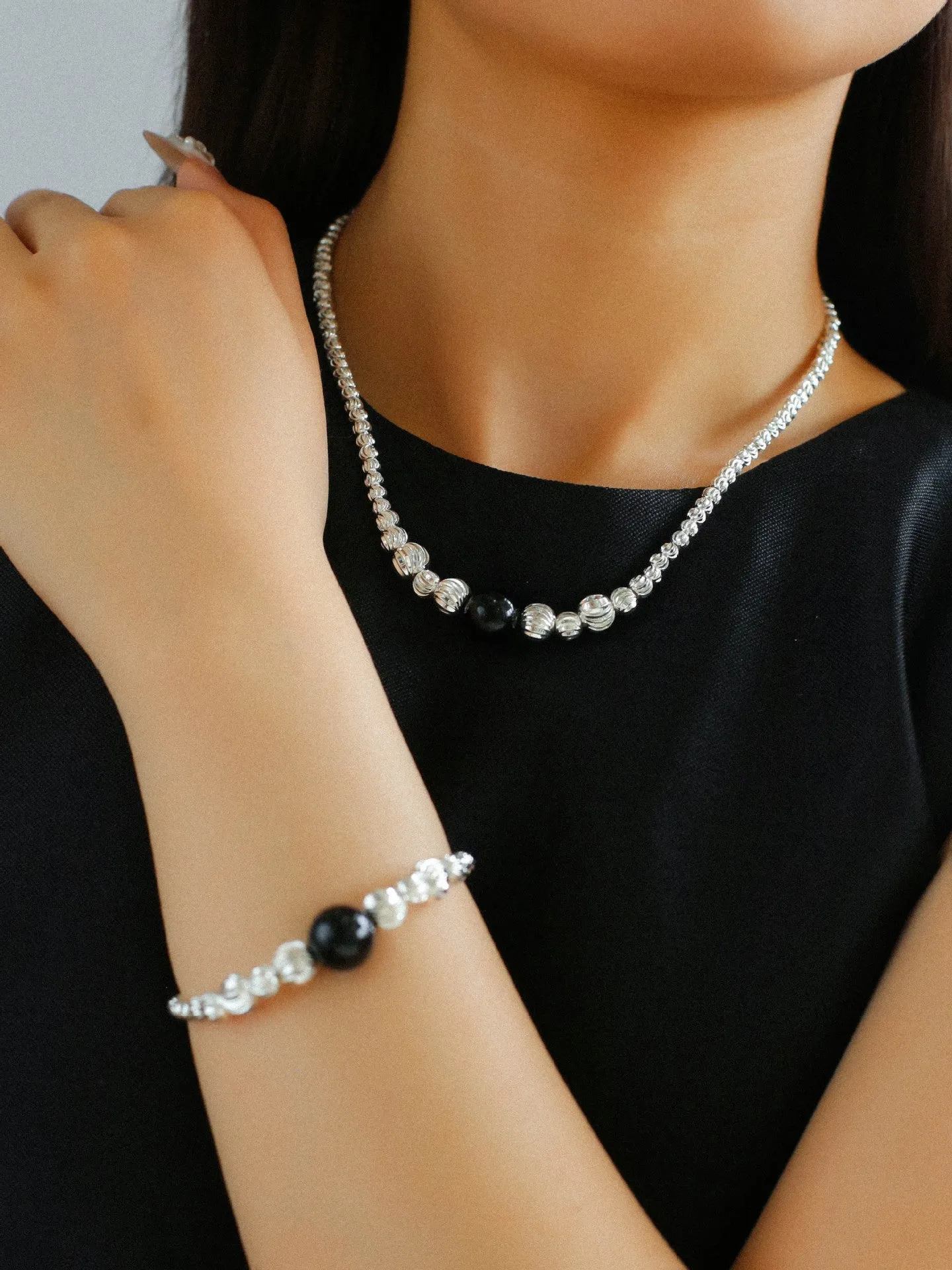 Graduated Silver Bean and Onyx Bracelet